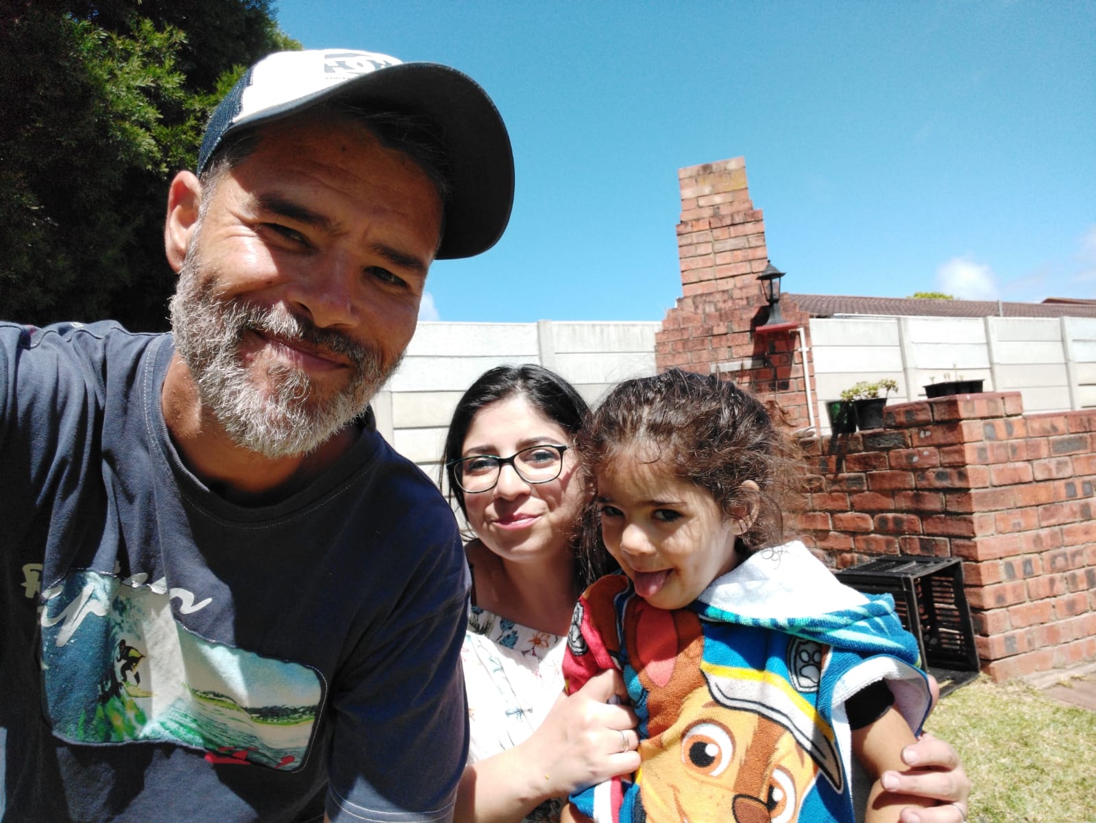 A Smiling Kevin, Anna and Gabi Vermaak in their Backyard